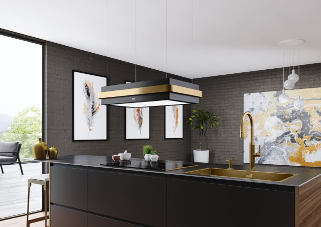 Okap Mythos Masteriece z detalem w kolorze miedzianym, który pasuje do pozostałych urządzeń na wyspie kuchennej
