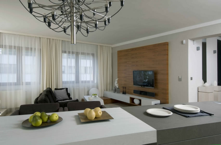 Wyspa kuchenna połączona w stołem.