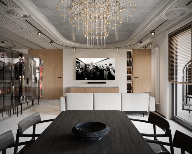 Betonowy sufit i sztukateria w salonie