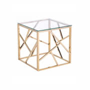 Złoty stolik kawowy ze szklanym blatem