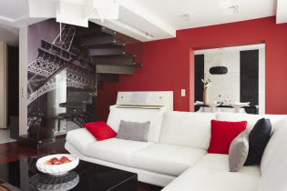 Biała kanapa w salonie. 3 kolory: biel, czerń, czerwień