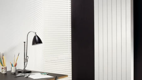 Ciepłe chwile w zimne dni - jak dopasować grzejnik do stylu Twojego salonu?