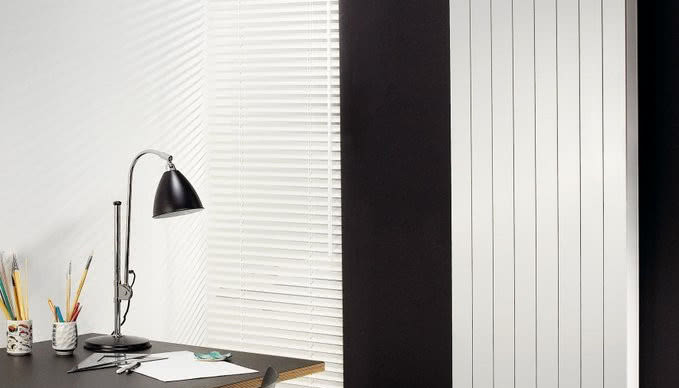 Ciepłe chwile w zimne dni - jak dopasować grzejnik do stylu Twojego salonu?