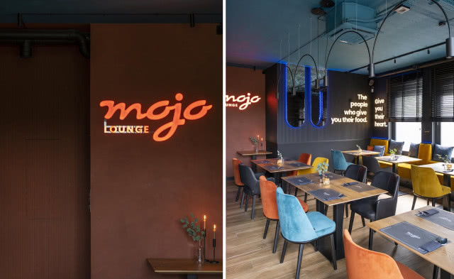 neon na ścianie i kolorowe krzesła w restauracji