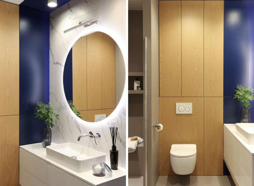 Granatowa zabudowa w łazience doskonale dopełnia...