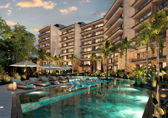 Basen i apartamenty inwestycji Distrito Xcalacoco Beach w Playa del Carmen w Meksyku.