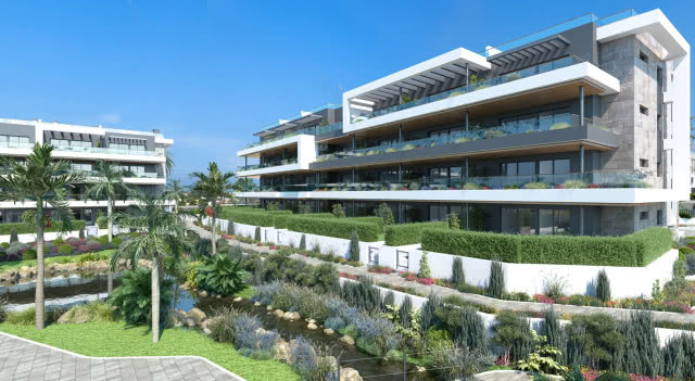 Lagoons Village w Torrevieja – nowoczesne apartamentowce otoczone zielenią i stawami.