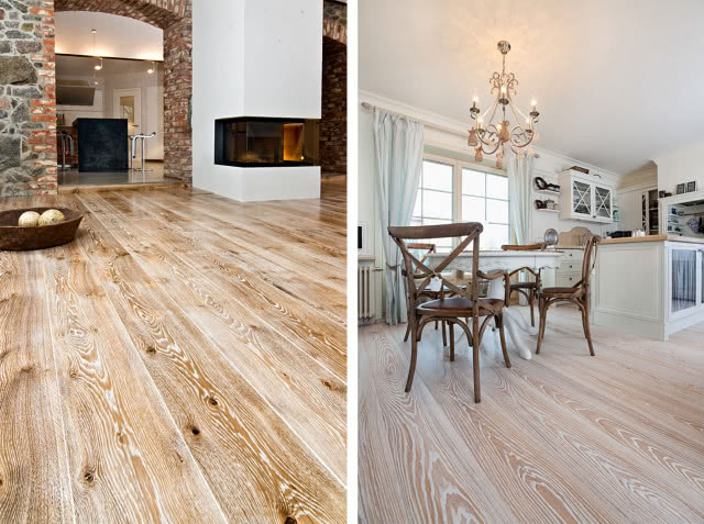 drewniana podłoga ze słojami i sękami, kominek, stół z krzesłami, wyspa kuchenna, oświetlenie sufitowe