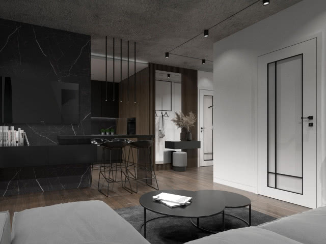 czarna ściana medialna, telewizor, szafka wisząca pod telewizorem, stołki barowe, drewniana podłoga, czarne stoliki kawowe, szara kanapa, dywan, przedpokój, pufa, wieszaki, lamele