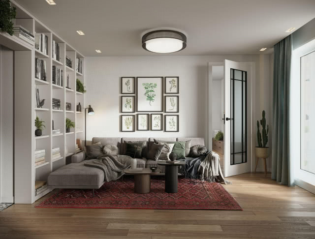 białe półki na książki i bibeloty, obrazy z motywami roślinnymi, kanapa, stoliki kawowe, koce, poduszki ozdobne, drzwi, kaktus, zasłony