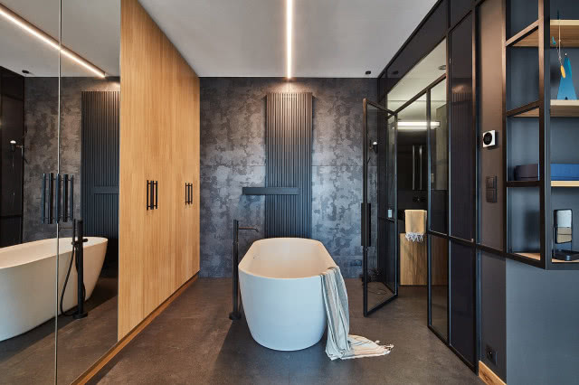 ciemna łazienka z dodatkiem kamienia i drewna