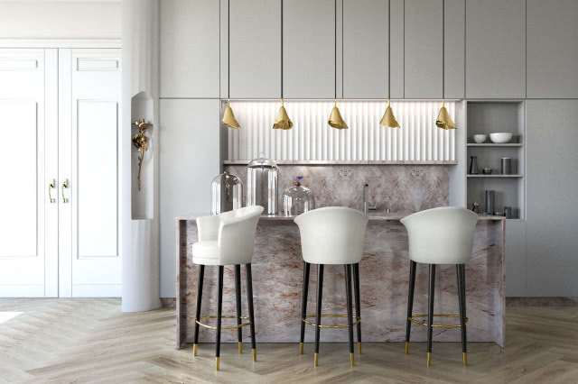 biała kuchnia ze złotymi lampami nad wyspą