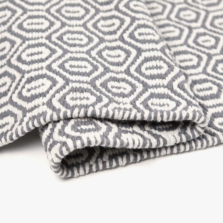 Bawełniany dywan z żakardowym geometrycznym wzorem