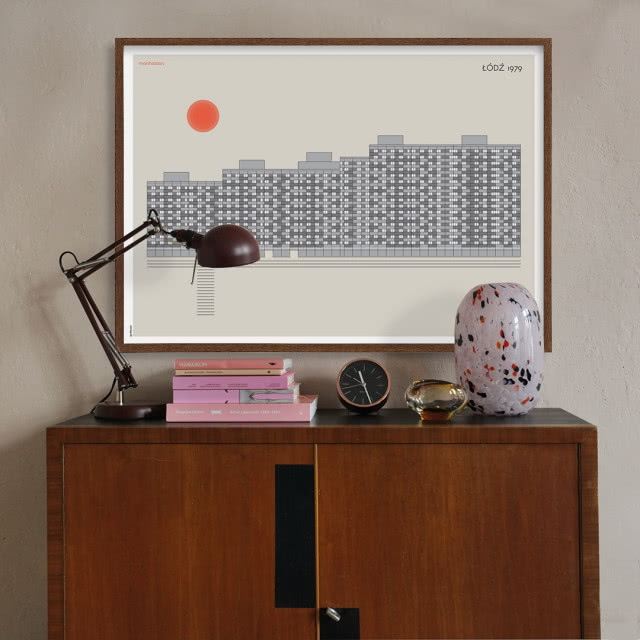 komoda w lampa, nad nią plakat z blokami