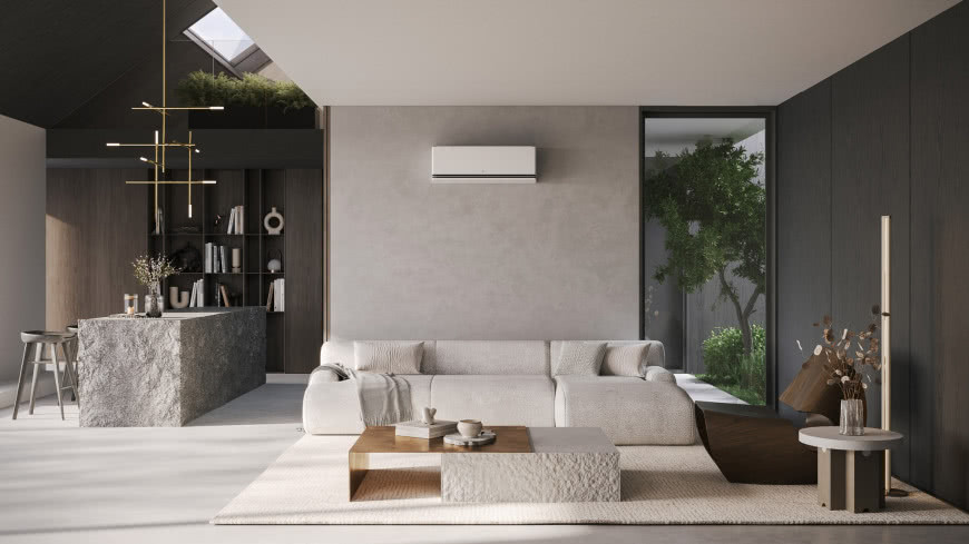 Nowoczesny salon z aneksem kuchennym i klimatyzatorem LG DUALCOOL AI Premium zamontowanym na ścianie.