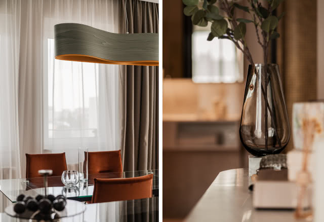 Aranżacja jadalni z lampą wiszącą nad stołem