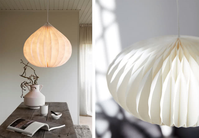 Papierowe lampy w stylu japandi i modern organic nad drewnianym stołem, inspirowane japońskim minimalizmem.