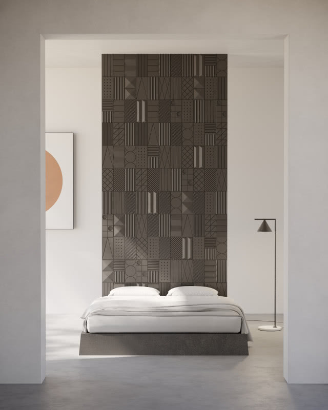 szare płytki strukturalne na ścianie w sypialni, ściana wygląda jak duży, wysoki zagłówek