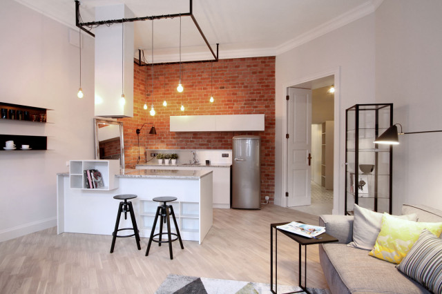 Industrialny salon z aneksem kuchennym