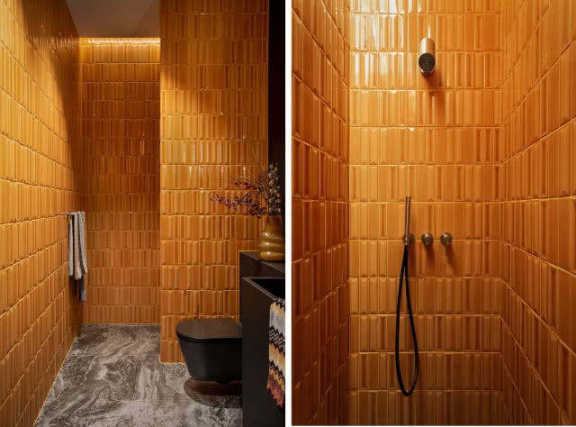 Pomarańczowe cegiełki w łazience