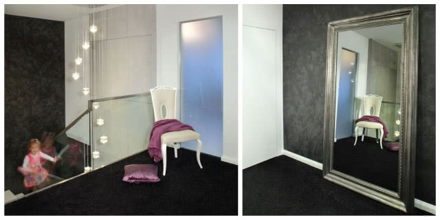 Klatka schodowa. Tynki strukturalne pojawiające się w salonie mają swoją kontynuację na klatce schodowej. Jej surowość łagodzi miękka czarno-srebrzysta wykładzina, która wyścieła podłogę na podestach.