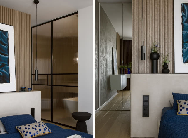 Sypialnia z drewnem i mikrocementem i niebieskimi dodatkami