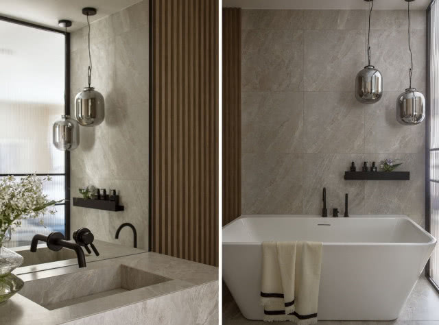 Kamienna umywalka i wanna wolnostojąca w łazience