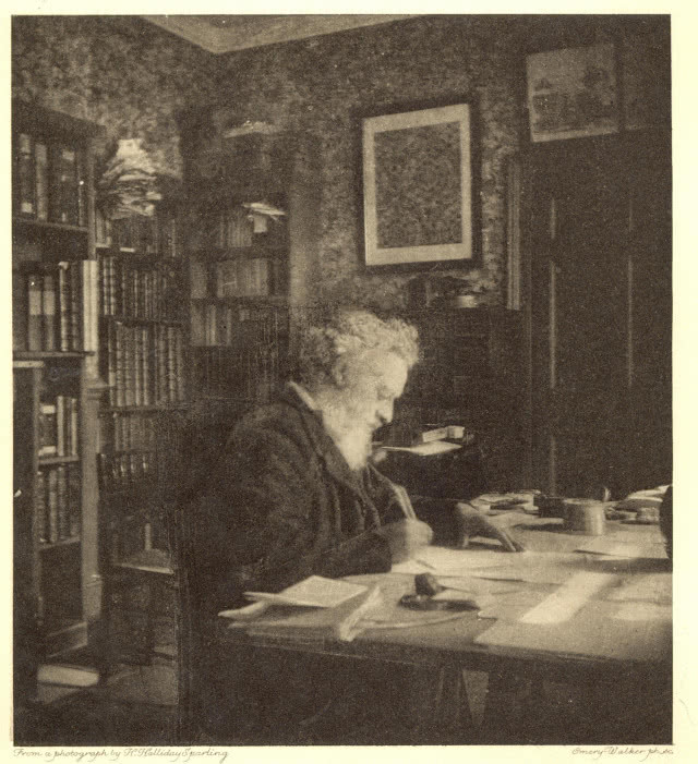 William Morris przy biurku - coś pisze