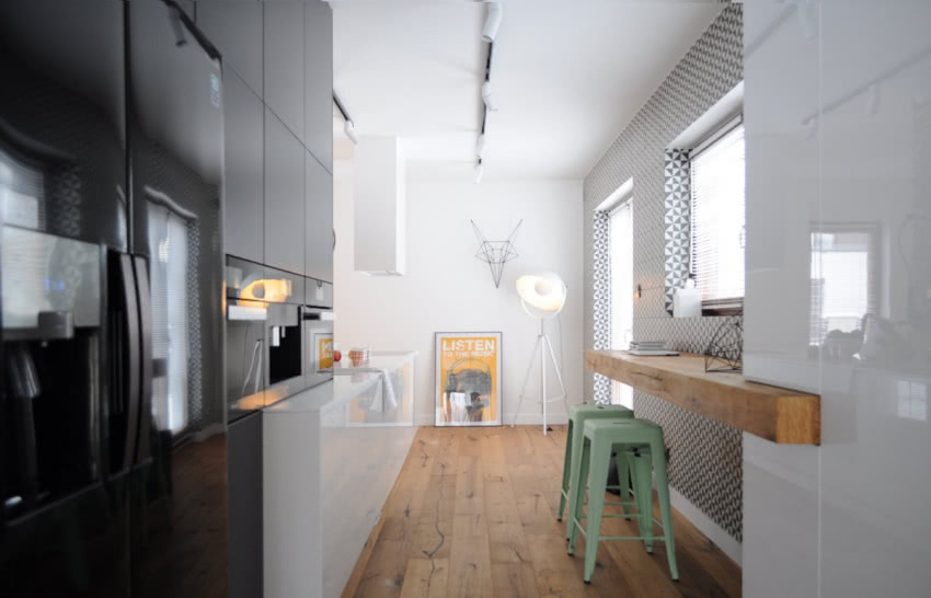 Minimalistyczna kuchnia z wyspą i kącikiem...