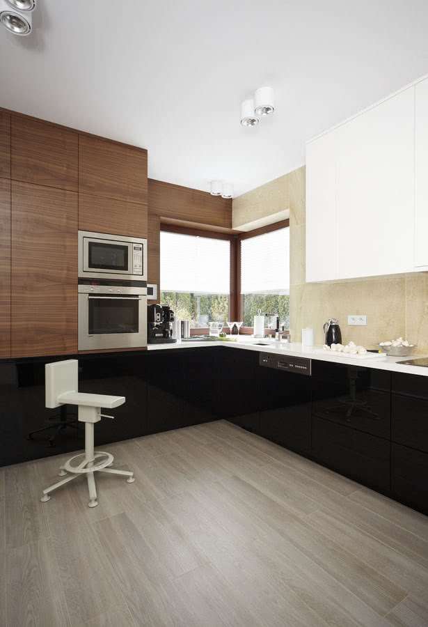 W kuchni orzechowy fornir dopasowano do...