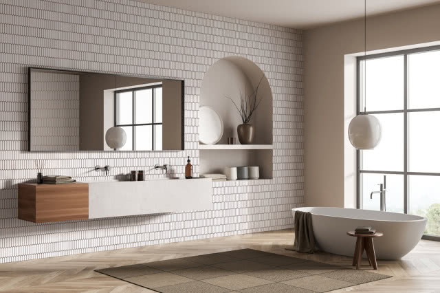 wanna wolnostojąca, szafka podwieszana, dwie umywalki, duże prostokątne lustro, półki, dywan, stołek, duże okno