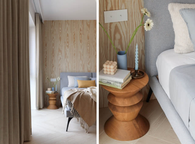 Stonowana sypialnia z drewnianą ścianą