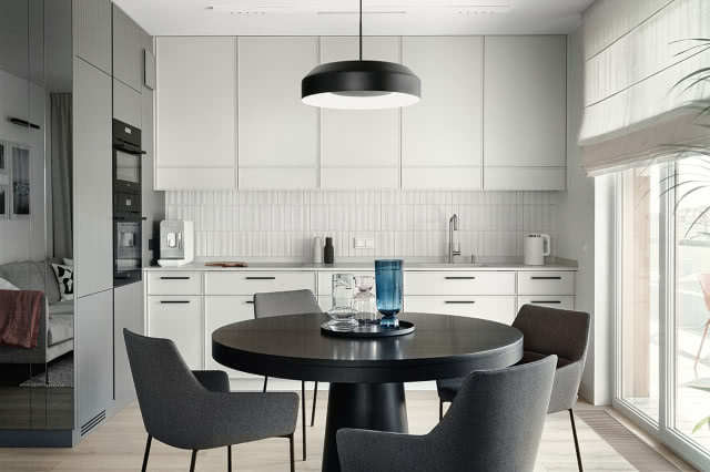 Biała kuchnia z czarnym okrągłym stołem